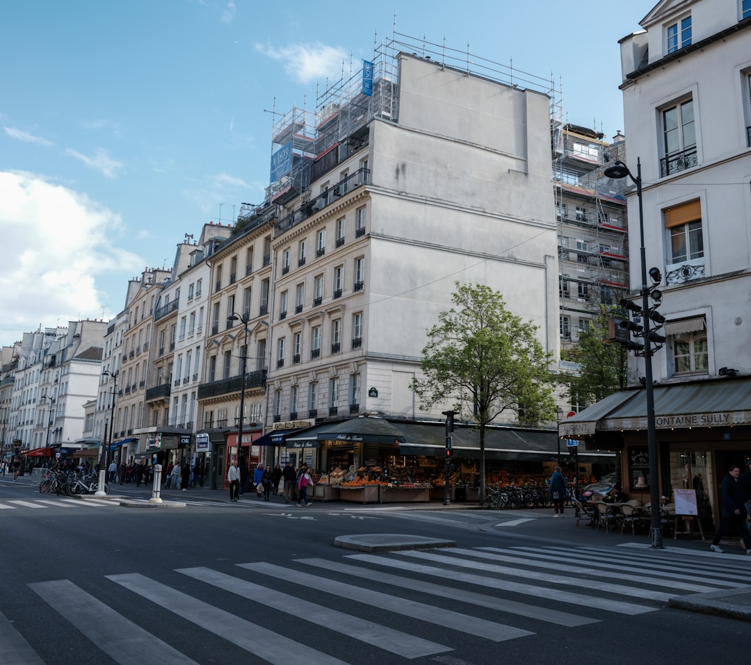 Street scene with buildings and market stalls.